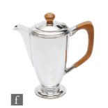 A hallmarked silver hot water pot of plain cylindrical tapering form, weight 13.5oz, terminating
