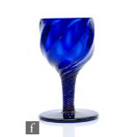 An 18th Century Bristol blue drinking glass circa 1755, the ovoid wrythen fluted ball falling to