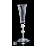 An 18th Century ale glass circa 1755, the trumpet form bowl above a multiple series air twist stem