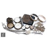 A small parcel lot of silver and white metal items to include two pocket watches, chains, a