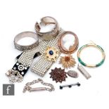 A parcel lot of assorted vintage jewellery to include an oval cameo brooch, a paste set belt,