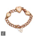An early 20th Century 9ct rose gold open curb link bracelet, total weight 18.5g, details with a