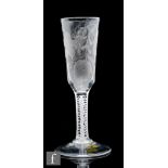 An 18th Century ale glass circa 1760, the elongated ogee bowl engraved with hops and barley, above a