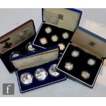 An Elizabeth II 2001 to 2005 set of silver proof one pound coins, cased with certificates, a similar