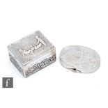 An Edward VII hallmarked silver rectangular box decorated with embossed cherubs and foliate scrolls,