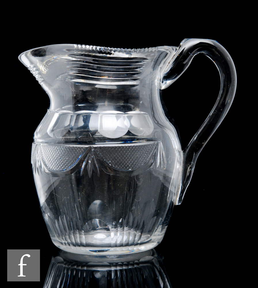 A late Georgian Irish cut crystal glass water jug in the Waterford style, of shouldered ovoid