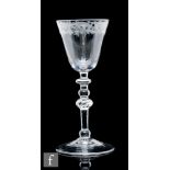 A Newcastle light baluster drinking glass circa 1740, the round funnel bowl engraved to the upper