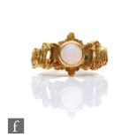 A modern 18ct hallmarked single stone opal ring, circular collar set stone to an abstract pierced