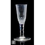 An 18th Century ale glass circa 1780, the round funnel bowl above a diamond facet stem, raised to