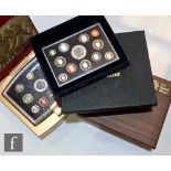 Two Elizabeth II Royal Mint Executive proof sets, 2008 and 2011, each in teak cases, a 2003