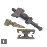 A Saxon iron cruciform brooch, side terminals missing, length 11cm, a similar belt buckle, a similar