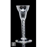 An 18th Century drinking glass circa 1750, the pan top bowl above a mercury twist stem, raised to