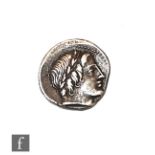 A Roman Denarius 86 BC, Rome head of Apollo to the right, the reverse Jupiter in fast quadriga to