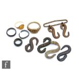 Nine Roman to Medieval artefacts to include a gold finger ring set with a natural brown stone, a