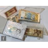 A small album of 1940s English one pound banknotes, Beale and Peppiatt, a ten shilling note, a