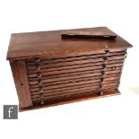 A Victorian mahogany coin cabinet fitted with seven drawers, turned wood handles, enclosed by