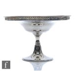 A hallmarked silver circular tazza circular foot below knop column panelled bowl with pierced