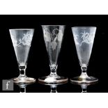 A pair of 18th Century dwarf ale glasses circa 1780, the bowl engraved with flowers above a short