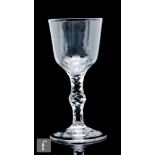 A late 18th Century goblet circa 1775, the round funnel bowl with basal petal cutting above a