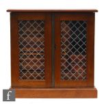 A mahogany coin cabinet fitted with an arrangement of sliding trays with coin inset divisions