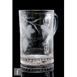 An 18th Century glass tankard circa 1830-1840, of cylindrical form, engraved with hops and barley,