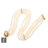 A cultured pearl four uniform four row choker, each row comprising approximately sixty pearls each