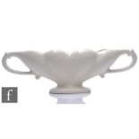 A Fulham Pottery mantle vase designed by William John Marriner, the whole glazed in white, printed