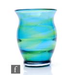 An early 20th Century Stevens & Williams Rainbow style glass vase, of flared ovoid form with