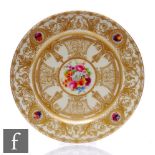 A Royal Worcester hand painted cabinet plate, decorated to the centre with a floral spray by E.
