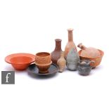 A Roman Samian ware rimmed bowl, diameter 15.5cm, a similar cup, 8cm, various vases and a small