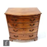 An early 20th Century George III style mahogany bow front dressing chest, fitted with four graduated