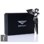 A chrome plated Bentley bottle stopper in black presentation case and outer sleeve.