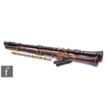 Two brass mounted clarinets and a brass penny whistle. (3)