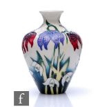 A small Moorcroft Pottery vase decorated in the Alpine Meadow pattern designed by Nicola Slaney,