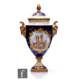 A boxed Coalport 'The Lincoln Cathedral' vase and cover decorated with a hand painted scene of