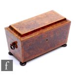 A 19th Century crossbanded birds eye maple tea caddy of sarcophagus form, fitted with two
