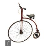 A child's penny farthing with Dunlop seat, height 98cm.