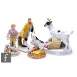 An early 20th Century Meissen model of a goat stood over a basket of spilled flowers and