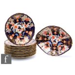 A set of twelve Royal Crown Derby Imari pattern 8683 plates, together with a matching oval dish, all