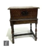 An 18th Century and later carved oak bible box with lunette frieze to the front and sides, on