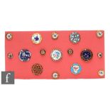 Seventeen assorted 19th Century and later enamel buttons of varying form and size with floral