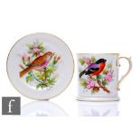 A small Royal Worcester mug decorated with a hand painted chaffinch perched on a flowering branch,