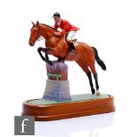 A Royal Worcester equestrian model of Foxhunter and Lt. Col. H.M. Llewellyn CBE modelled by Doris