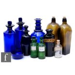 Two 19th century cobalt blue chemists bottles and stoppers of cylindrical form, another named '