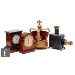 An Edwardian mahogany cased G.P.O clock, height 18cm, a small mantle clock, a magic lantern and a