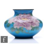 A Japanese cloisonne vase of compressed ovoid form, the turquoise blue ground decorated with large