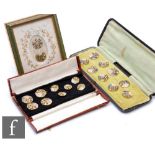 A set of nine 19th Century buttons each enamel decorated on gilt metal with roses and foliage