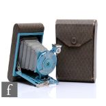 A Kodak Petite folding vest pocket camera, circa 1929, blue metalwork colourway, with grey diamond