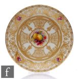 A Royal Worcester hand painted cabinet plate decorated by H Martin with fruit and foliage with a