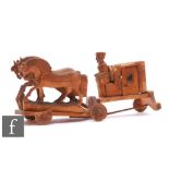 An early 20th Century Russian carved pine child's toy, modelled as a coach drawn by three horses,